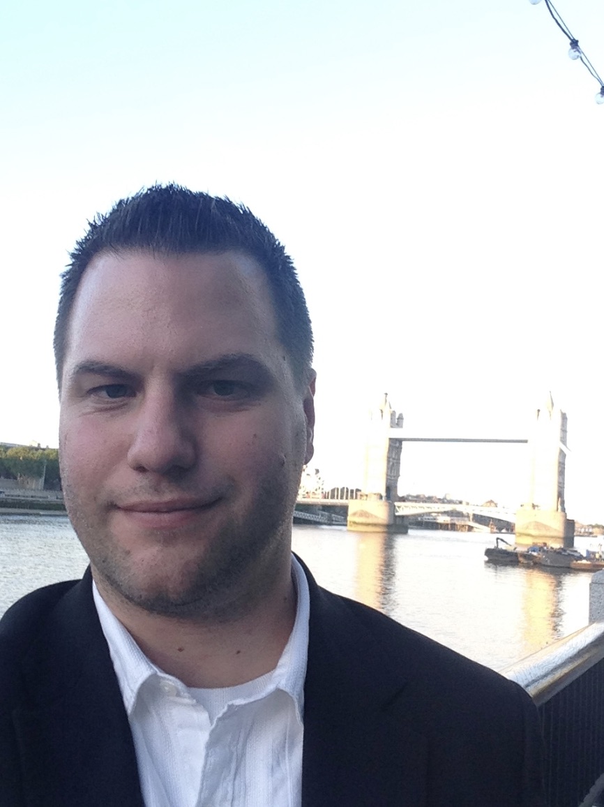 Sean Peever in London with Tower Bridge in the background